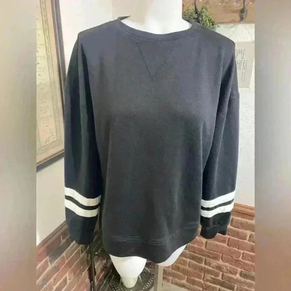 Pretty Garden Long sleeved black sweatshirt with 2 stripes on wrists. Size Small
